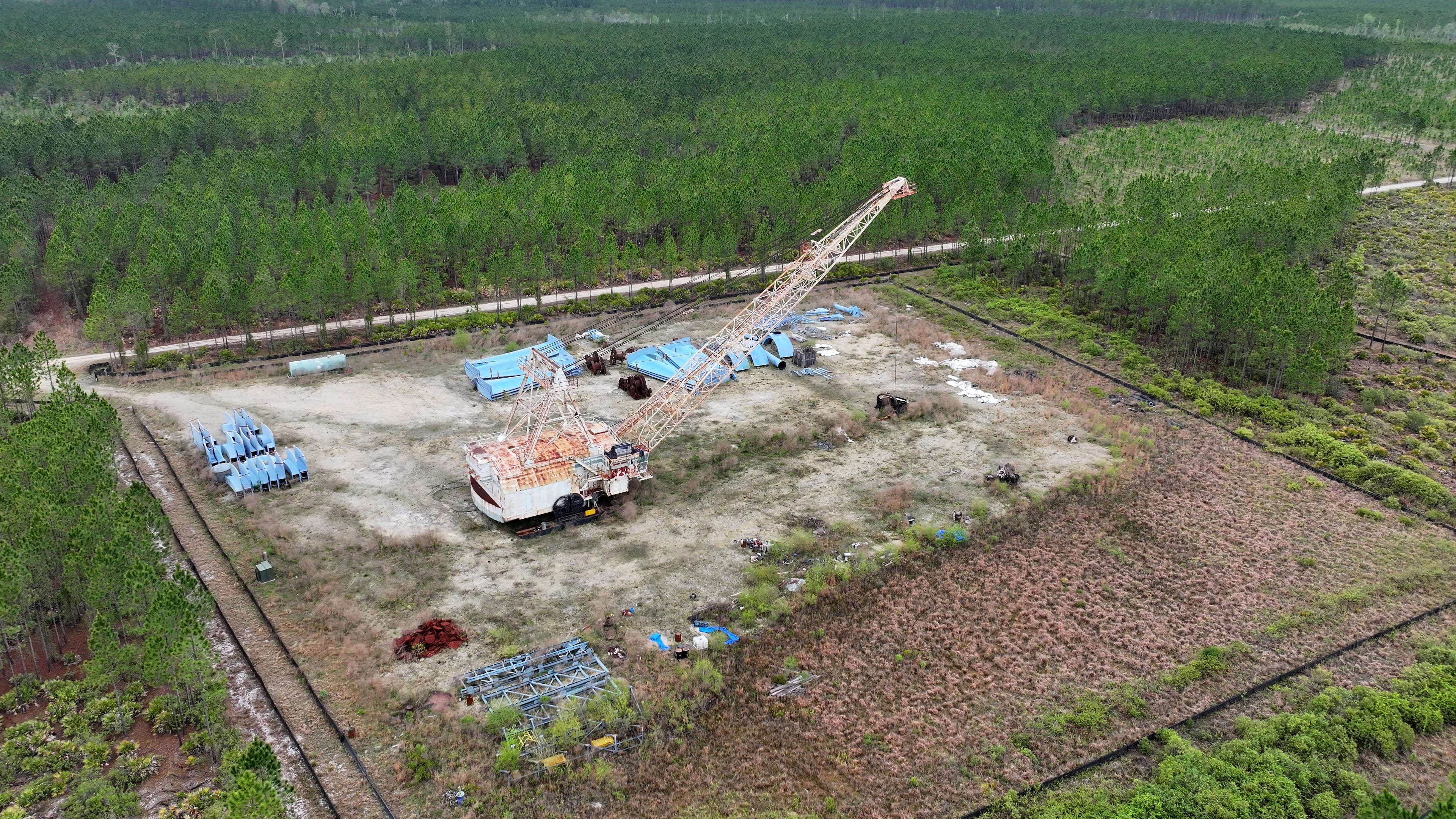 Twin Pines began storing equipment at this site in Charlton County near the Okefenokee Swamp. The company and some of its affiliates are facing lawsuits from companies that allege they’re owed millions in unpaid services. (Hyosub Shin/AJC)