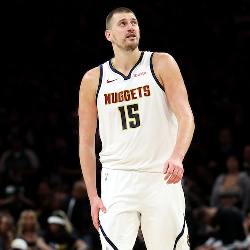 Denver Nuggets center Nikola Jokic (15) looks on during the second half of Game 6 of a first-round NBA basketball playoffs series against the Minnesota Timberwolves, Thursday, April 30, 2026, in Minneapolis. (AP Photo/Matt Krohn)