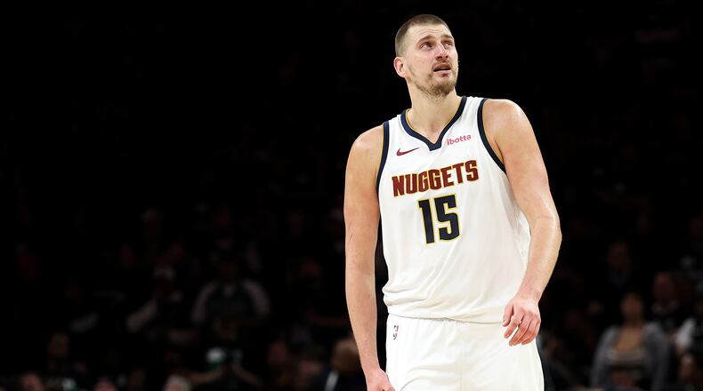 Denver Nuggets center Nikola Jokic (15) looks on during the second half of Game 6 of a first-round NBA basketball playoffs series against the Minnesota Timberwolves, Thursday, April 30, 2026, in Minneapolis. (AP Photo/Matt Krohn)