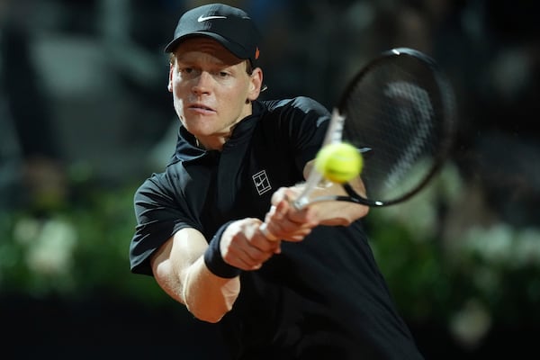 Italy's Jannik Sinner returns a shot during a round of sixteen match against Argentina's Francisco Cerundolo at the Italian Open tennis tournament in Rome, Tuesday, May 13, 2025. (AP Photo/Andrew Medichini)