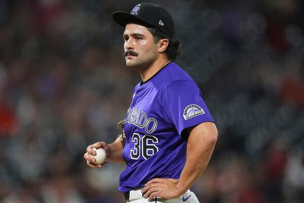 Colorado Rockies relief pitcher Zach Agnos waits to be pulled from the mound after issuing a walk to San Francisco Giants' Willy Adames in the ninth inning of a baseball game Tuesday, June 10, 2025, in Denver. (AP Photo/David Zalubowski)