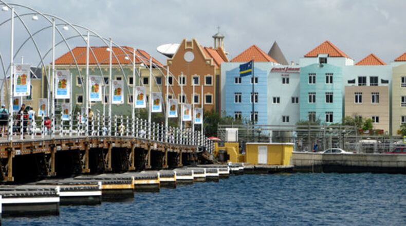 The Queen Emma Pontoon Bridge in Willemstad. capital of Curaçao. The Kura Hulanda Museum at the end of the bridge was built on the site of a slave auction.