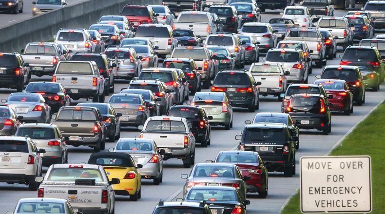 Traffic much like this funnels into Peachtree Corners along Peachtree Industrial Boulevard. The city is kicking-off a Comprehensive Transportation Plan to make improvements. JOHN SPINK / JSPINK@AJC.COM