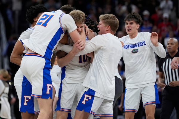 Florida players celebrate their win over Texas Tech in the Elite Eight of the NCAA college basketball tournament, Saturday, March 29, 2025, in San Francisco. (AP Photo/Godofredo A. Vásquez)
