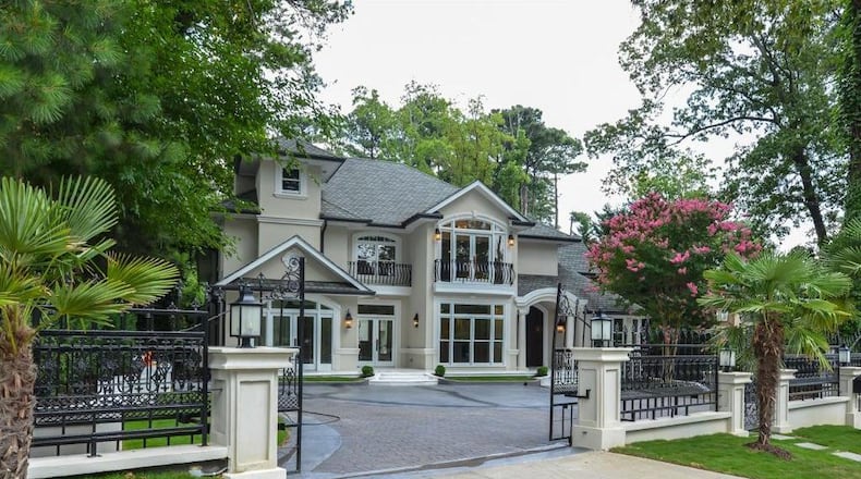 Ornate wrought iron accents add to the elegant entrance to this Buckhead estate.