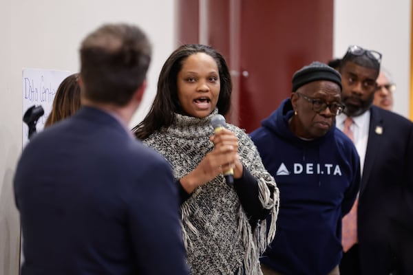 DeKalb resident Stacey Shorts speaks during the Q&A portion of a town hall held by Commissioner Ted Terry about data centers, at the Porter Sanford III Performing Arts & Community Center in south DeKalb on Wednesday, Dec. 10, 2025. (Natrice Miller/AJC)