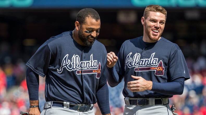 Freddie Freeman, right, laughs with Matt Kemp during a September win against the Phillies. Kemp was already hot at the plate but heated up further since the arrival of Kemp in the cleanup spot behind him in the batting order. (AP Photo/Chris Szagola)