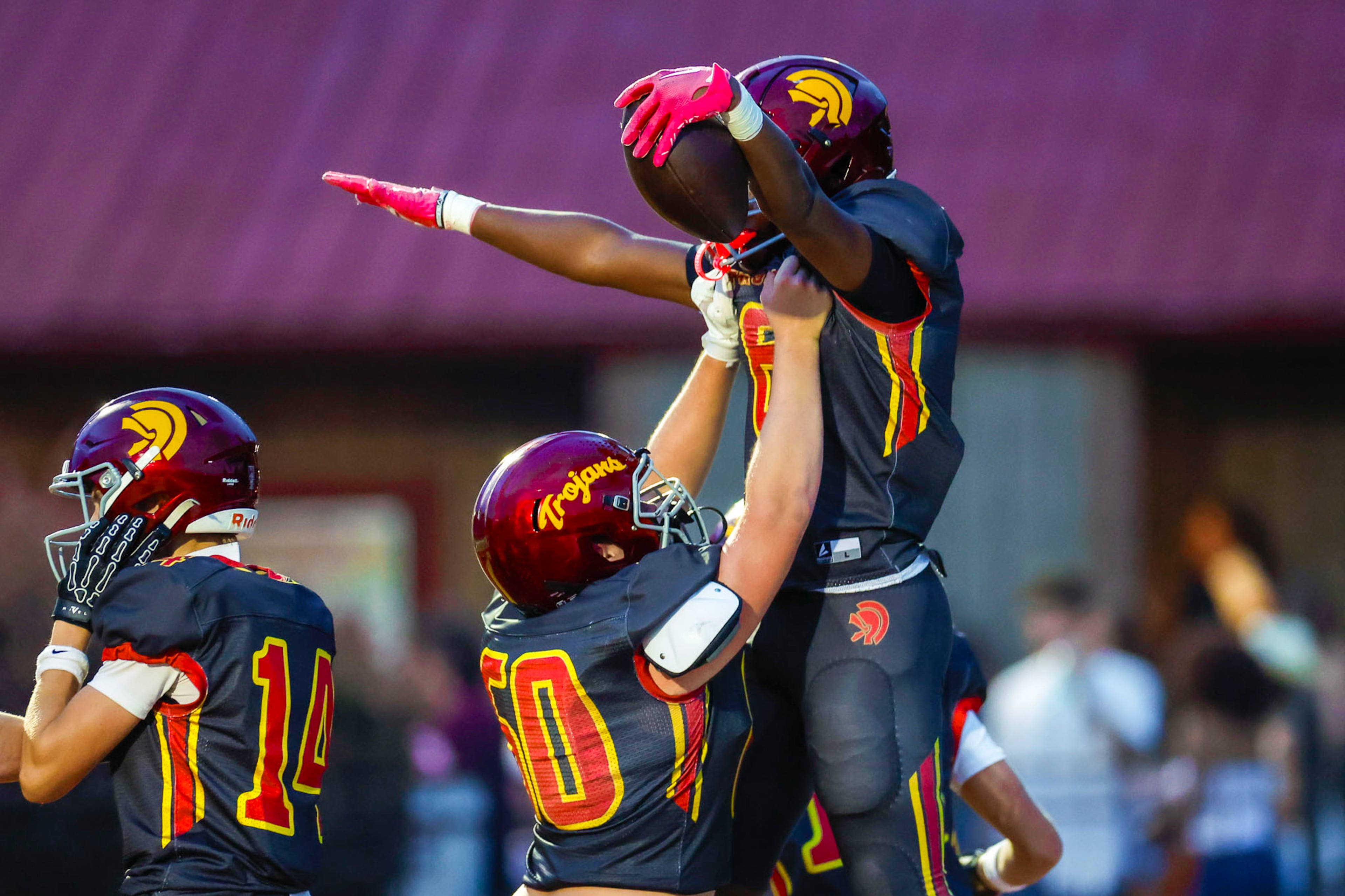 Lassiter flanker Drew McGee (right) celebrates a touchdown against Creekview at Lassiter High School on Friday, Sept. 5, 2025, in Marietta. (Oscar Guevara Saenz for the AJC)