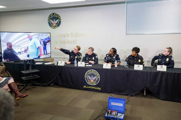 Maj. David Wilson (left) points at the screen, outlining the timeline of events from the arrival of Billy Joe Cagle at Hartsfield-Jackson Atlanta International Airport to his arrest. (Miguel Martinez/ AJC)