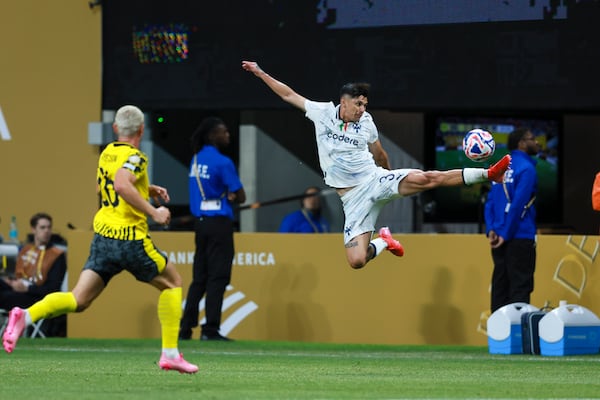 Monterrey defender Gerardo Arteaga jumps to stop the ball during Tuesday night's Club World Cup loss to Borussia Dortmund. 