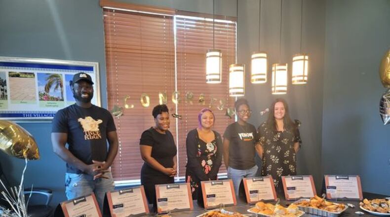 Scholarship recipients celebrate being awarded Dominium's Opportunity's Front Door scholarship, which is designed to ease the pathway to higher learning. Courtesy of Dominium