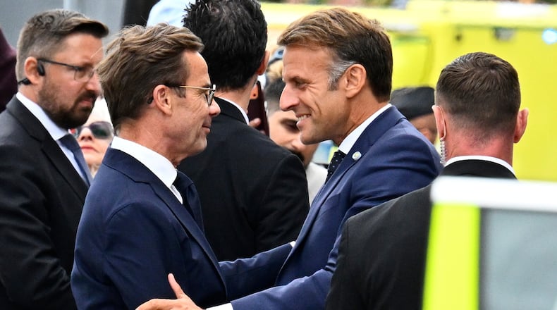 French President Emmanuel Macron, right, is welcomed by Swedish Prime Minister Ulf Kristersson, in Stockholm, Sweden, Monday, Aug. 31, 2026. (Anders Wiklund /TT News Agency via AP)