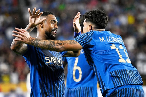 Al-Hilal's Malcom is congratulated by Al-Hilal's Marcos Leonardo after scoring his teams second goal during the Club World Cup round of 16 soccer match between Manchester City and Al Hilal in Orlando, Fla., Monday, June 30, 2025. (AP Photo/Phelan Ebenhack)