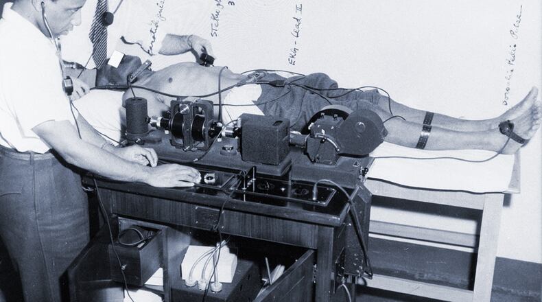 Researchers for the U.S. Public Health Service use an electrocardiogram to check the heart of a participant in the Tuskegee Syphilis Study — most likely in 1932. (Courtesy of National Archives)