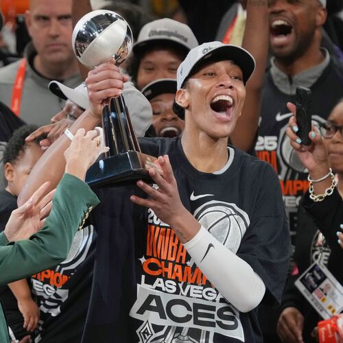 FILE - Las Vegas Aces center A'ja Wilson, center right, holds up her MVP trophy after Game 4 of the WNBA basketball finals against the Phoenix Mercury, Friday, Oct. 10, 2025, in Phoenix. (AP Photo/Rick Scuteri, File)