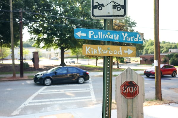 Signs for Pullman Yards and the Kirkwood neighborhood are shown across the street from Toomer Elementary School near Pullman Yards on June 30, 2026. (Jason Getz/AJC)