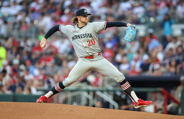 Minnesota Twins pitcher Chris Paddack (20) delivers in the first inning of a baseball game against the Atlanta Braves, Friday, April 18, 2025, in Atlanta. (AP Photo/Colin Hubbard)