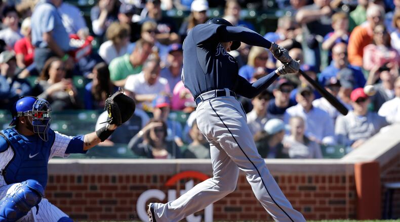 Atlanta Braves' Freddie Freeman hits a two-run home run against the Chicago Cubs during the first inning.