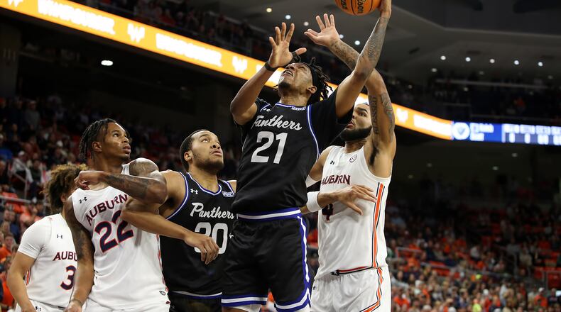Kalik Brooks (21) of Georgia State tries to muscle through some Auburn players. Special to the AJC