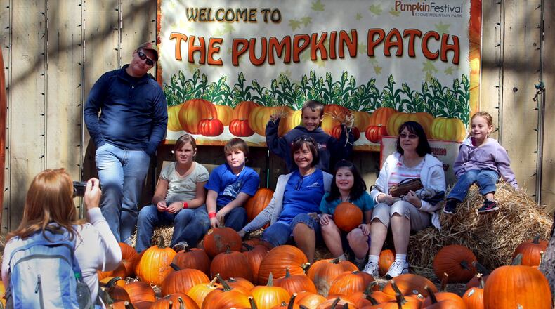 The Jarrell family of Cochran, Ga., gets their photograph taken by a family member at the Pumpkin Patch during Pumpkin Fest at Stone Mountain Park Saturday afternoon in Stone Mountain, October 1, 2011.