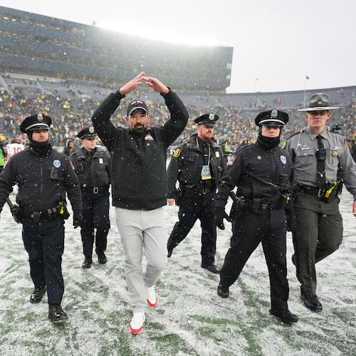 Ohio State Buckeyes head coach Ryan Day celebrates after the team's win against Michigan in an NCAA college football game, Saturday, Nov. 29, 2025, in Ann Arbor, Mich. (AP Photo/Ryan Sun)