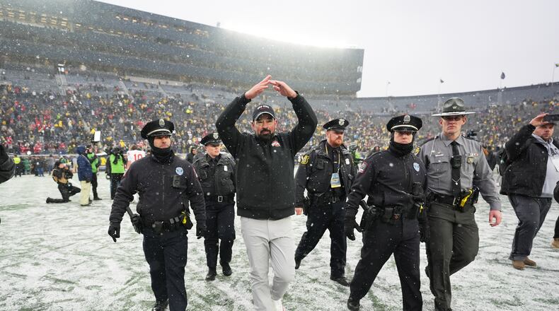 Ohio State Buckeyes head coach Ryan Day celebrates after the team's win against Michigan in an NCAA college football game, Saturday, Nov. 29, 2025, in Ann Arbor, Mich. (AP Photo/Ryan Sun)