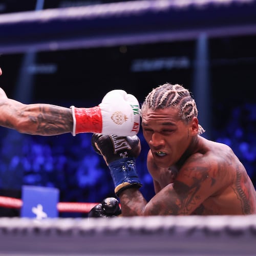Ryan Garcia, left, punches Conor Benn in their welterweight championship fight Saturday, Sept. 12, 2026, in Las Vegas. (AP Photo/Ian Maule)