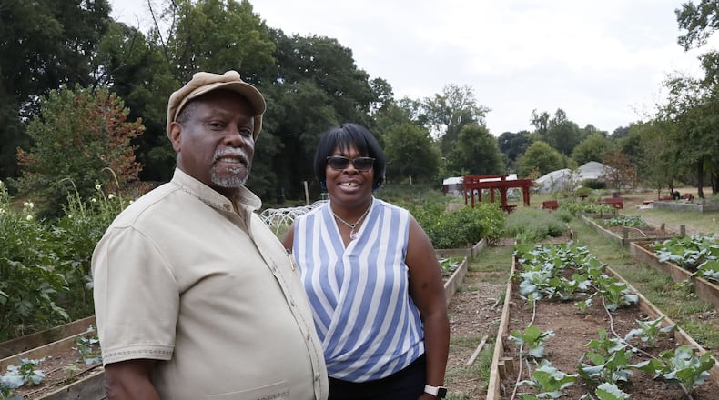 On a visit to the Truly Living Well urban farm in Atlanta, K. Rashid Nuri (left) talks with Carol Hunter, the executive director of Truly Living Well. Nuri is known as the elder statesman of Atlanta’s urban gardening. Nuri, 71, founded the Truly Living Well program to promote healthy living through healthy foods, community and economic empowerment. Although he recently stepped down as head of Truly Living Well, his heart remains deep within the agricultural community he has built, one seed at a time. BOB ANDRES / ROBERT.ANDRES@AJC.COM