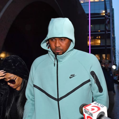 Cleveland Guardians baseball pitcher Luis Ortiz, center, departs Federal Court following a hearing, Monday, Nov. 10, 2025, in Boston. (AP Photo/Steven Senne)