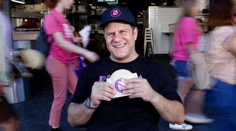 Umami Burger founder Adam Fleischman, with a peanut butter and jelly sandwich, at Grand Central Market in Los Angeles, Calif. (Christian K. Lee/Los Angeles Times/TNS)