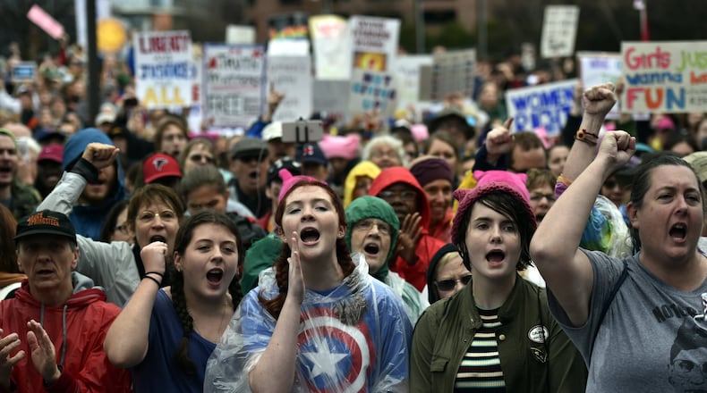 Marchers respond to speakers at the Center for Civil and Human Rights before the start of the Women’s March in Atlanta, Georgia, on Saturday, January 21, 2017. (DAVID BARNES / DAVID.BARNES@AJC.COM)