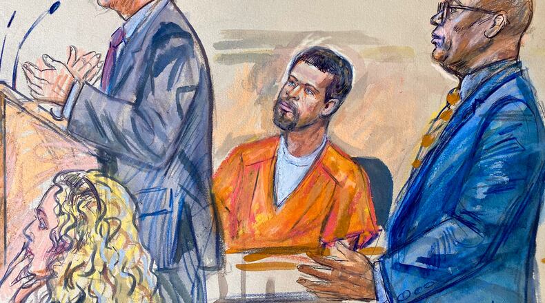 This courtroom sketch depicts Cole Tomas Allen, center, listening as his attorney Eugene Ohm, left, speaks to U.S. Magistrate Judge Zia Faruqui, Monday, May 4, 2026, in Washington, as Tony Towns, the acting general counsel for the District of Columbia Department of Corrections, listens at right. (Dana Verkouteren via AP)