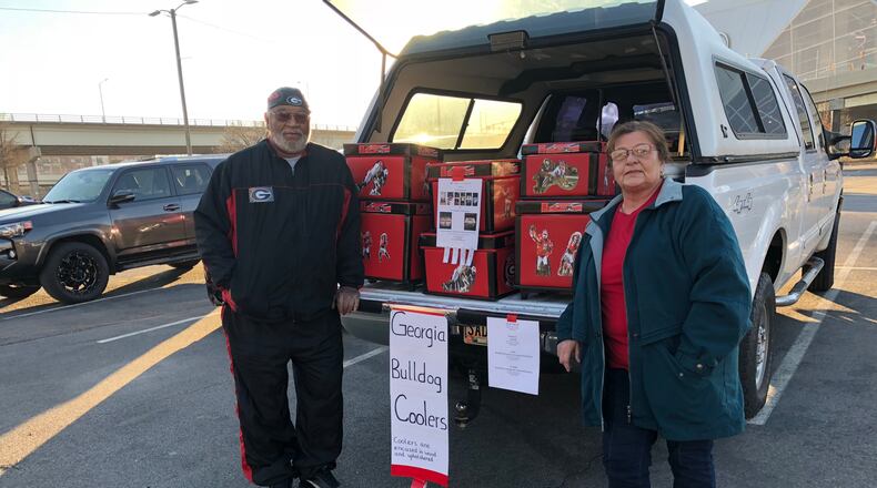 Aaron and Helga Thompson of Covington wants UGA fans to stay cool with their line of UGA-themed coolers HANDOUT