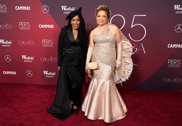 Spotlight Award honoree Angela Bassett, left, a cast member in "Black Panther: Wakanda Forever," poses with the film's costume designer Ruth E. Carter at the 25th Costume Designers Guild Awards, Monday, Feb. 27, 2023, in Los Angeles. (AP Photo/Chris Pizzello)
