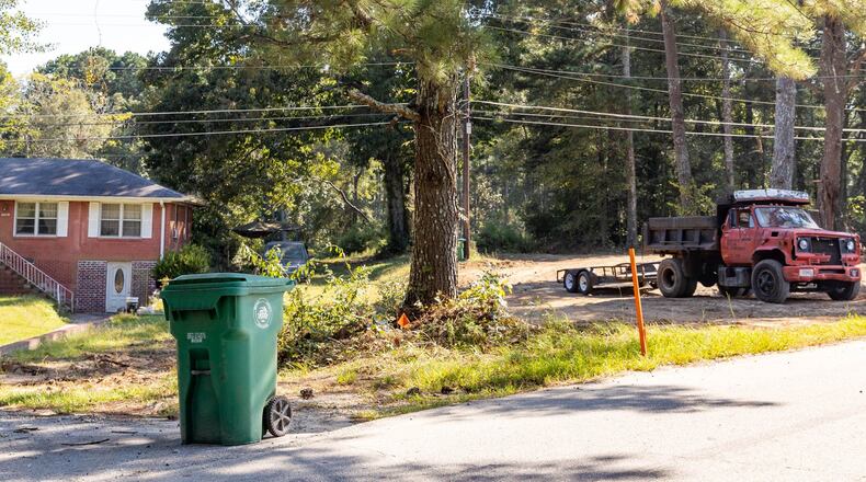 Stonecrest zoning has created several locations including this home on Maddox Road near Rogers Lake Road where residential properties are next to industrial operations allowing for industrial vehicles to overflow roadways, abandoned homes to be turned into dump sites and DeKalb County residents live beside concrete production facilities and junkyards. (Jenni Girtman for The Atlanta Journal-Constitution)