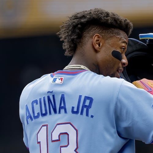 Atlanta Braves' Ronald Acuna Jr. adjusts his helmet while standing on third base against the Pittsburgh Pirates during the first inning of a baseball game, Saturday, June 6, 2026, in Atlanta. (AP Photo/Erik S. Lesser)