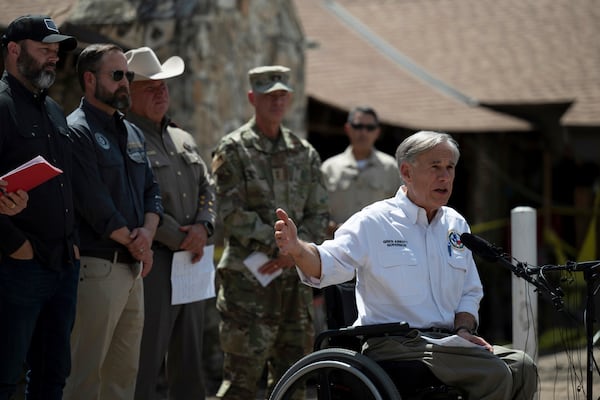 Texas Gov. Greg Abbott speaks during a press conference on Tuesday, July 8, 2025, after touring damage from flash flooding in Hunt, Texas. (AP Photo/Eli Hartman)