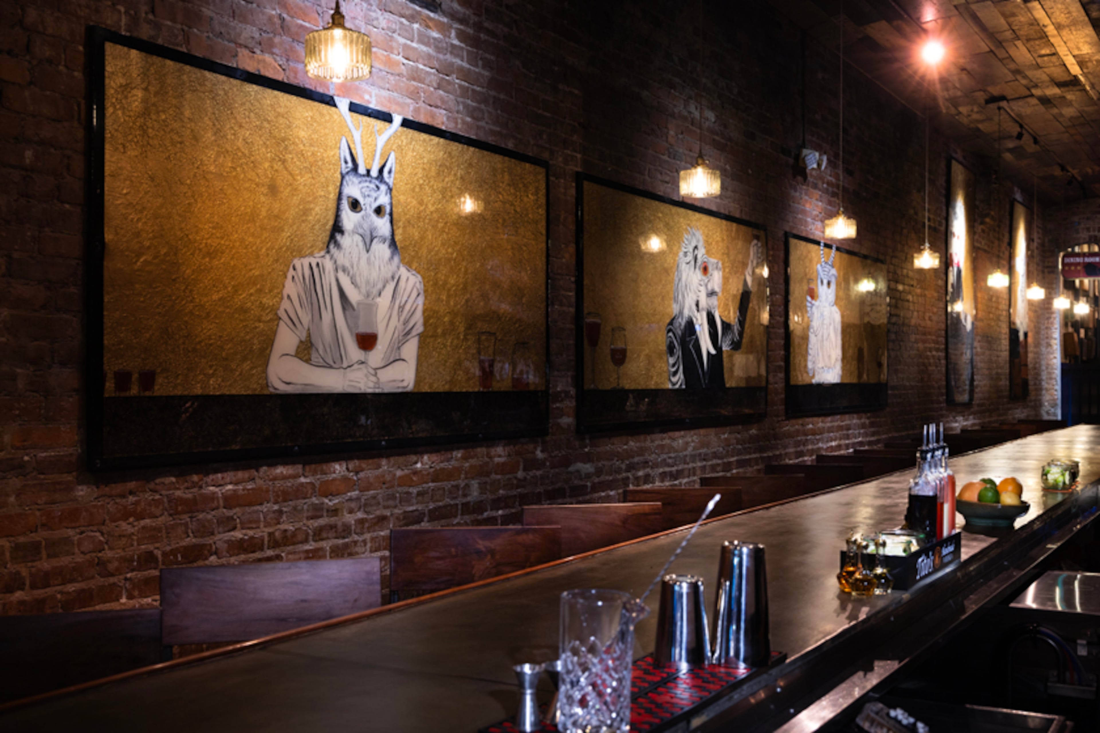 Paintings of animals drinking beer and wine hang near the front bar at Porter Beer Bar in Atlanta's Little Five Points neighborhood. (Courtesy of Porter Beer Bar)