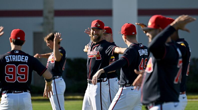 Braves pitcher Chris Sale (center) warms up with teammates during the first day of pitchers and catchers workouts Tuesday, Feb. 10, 2026, at CoolToday Park in North Port, Fla. Sale has agreed to a one-year contract extension worth $27 million. (Hyosub Shin/AJC)