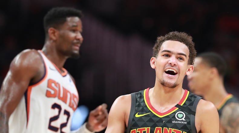 Hawks guard Trae Young is all smiles during the final minutes of a 123-110 victory over Deandre Ayton and the Phoenix Suns in a NBA basketball game on Tuesday, January 14, 2020, in Atlanta. Curtis Compton ccompton@ajc.com