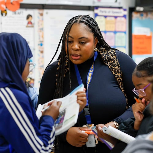 Elementary teacher Ashley Hill works with fifth grade students at Cliftondale Elementary in March. (Miguel Martinez/AJC)