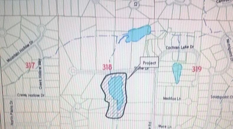 Owners of Gordon & Dees Lake and Dam will receive $138,630 more from the Cobb County commissioners - in addition to the $329,567 they received in April 2010 - to reduce the lake level by an additional four feet to the original reduction of nearly nine feet and to remove 16,500 tons of sediment. (Courtesy of Cobb County)