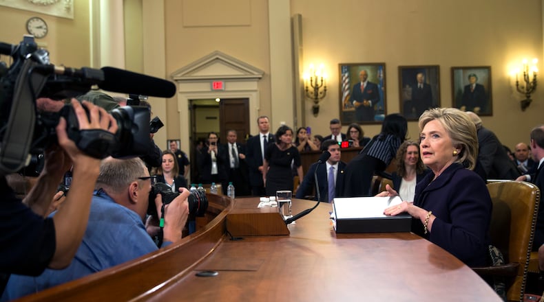 Democratic presidential candidate, former Secretary of State Hillary Rodham Clinton arrives back after a break to continue her testimony before the House Select Committee on Benghazi, on Capitol Hill on Thursday, Oct. 22, 2015, in Washington. (AP Photo/Evan Vucci)