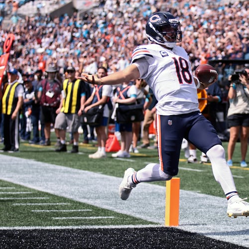 Chicago Bears quarterback Caleb Williams (18) runs to score a touchdown during the first half of an NFL football game, Sunday, Sept. 13, 2026, in Charlotte, N.C. (AP Photo/Scott Kinser)