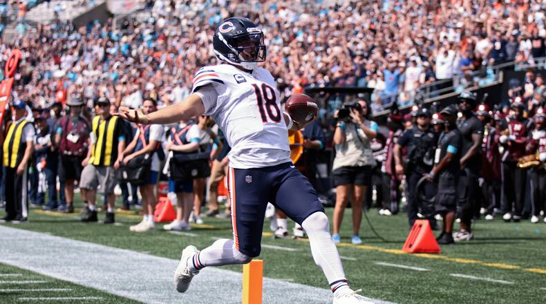 Chicago Bears quarterback Caleb Williams (18) runs to score a touchdown during the first half of an NFL football game, Sunday, Sept. 13, 2026, in Charlotte, N.C. (AP Photo/Scott Kinser)