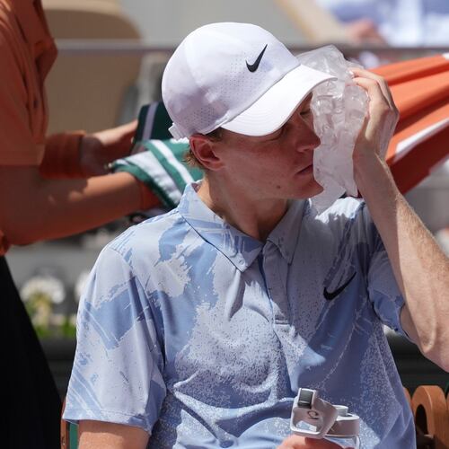Jannik Sinner of Italy cools himself with the ice during the second round men's singles tennis match against Juan Manuel Cerundolo of Argentina at the French Open tennis tournament in Paris, Thursday, May 28, 2026. (AP Photo/Thibault Camus)