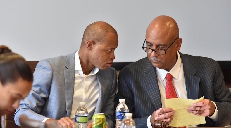 September 10, 2019 Atlanta - Christopher Edwards (right), the chairman of the Atlanta Housing Authority (AHA) board, confers with Robert Rumley III (left), vice chairman of the AHA board, during a board meeting at the Atlanta Housing Authority on Tuesday, September 10, 2019. (Hyosub Shin / Hyosub.Shin@ajc.com)