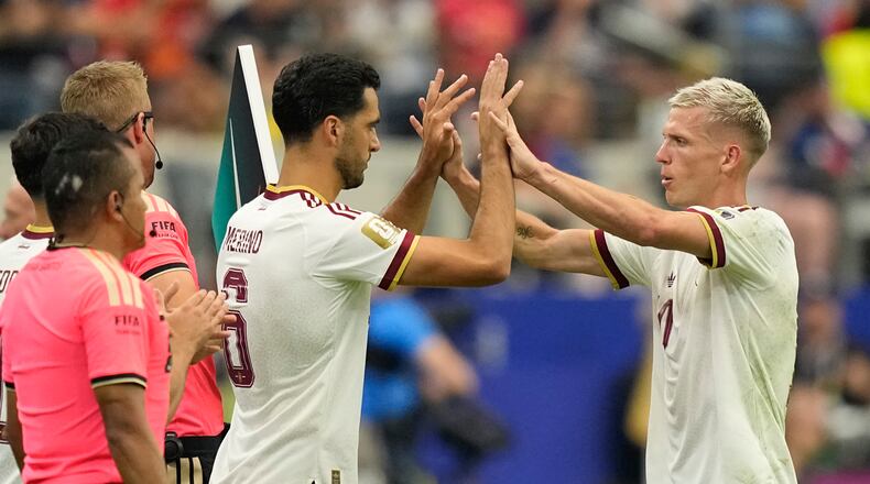 Spain's Dani Olmo, right, greets teammate Mikel Merino (6) as Olmo is replaced by Merino during the World Cup semifinal soccer match between France and Spain in Arlington, Texas, near Dallas, Tuesday, July 14, 2026. (AP Photo/Ashley Landis)