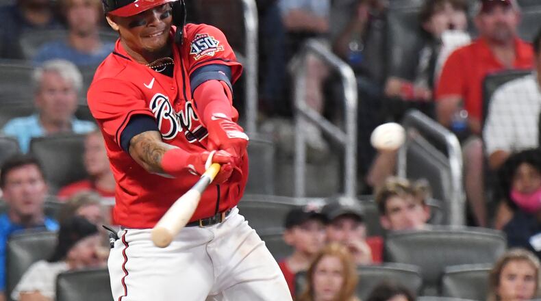 Braves shortstop Orlando Arcia (9) hits a RBI single in the seventh inning Friday, July 16, 2021, at Truist Park in Atlanta. (Hyosub Shin / Hyosub.Shin@ajc.com)