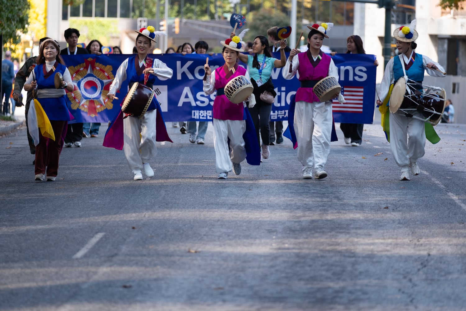 The Korean Veterans Association marches down Peachtree Street while participating in the Georgia Veterans Day Parade in Midtown Atlanta on Saturday, Nov. 8, 2025.   Ben Gray for the Atlanta Journal-Constitution